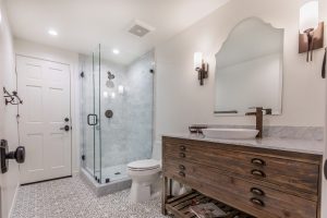 Distressed bathroom vanity and shower