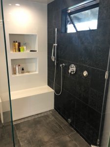 Shower with built-in seat bench