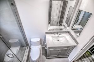 modern toilet and vanity in upgraded bathroom in Calabasas, California